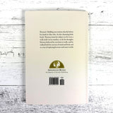 Back cover of a book by Applewood Books on a wooden surface
