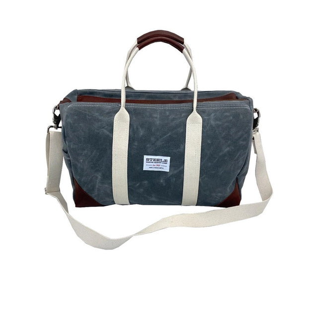 a frontal view of the waxed briquette canvas weekender bag