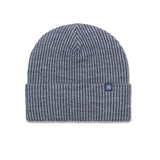 A navy blue and white heathered knit beanie hat with a folded cuff and a small navy logo patch on the side, shown against a plain white background.