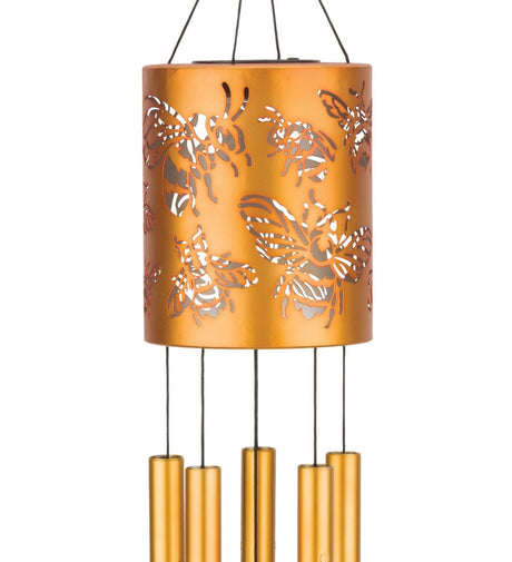 close up view of the chime cylinder with bee engravings and chimes hanging below