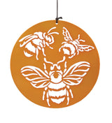 close up view of the chime disc with bee engravings