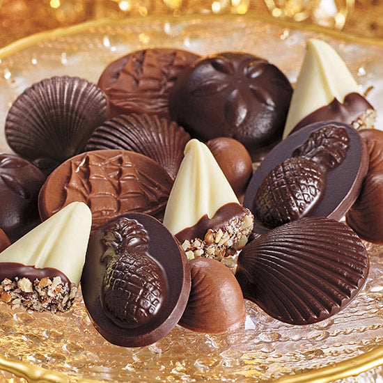 Assorted chocolate candies on a gold plate