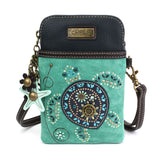 a faux leather crossbody bag with turquoise color and sea turtle design