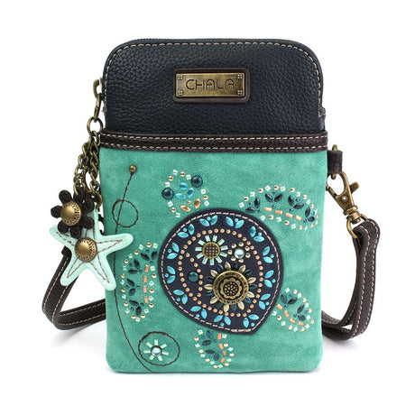 a faux leather crossbody bag with turquoise color and sea turtle design