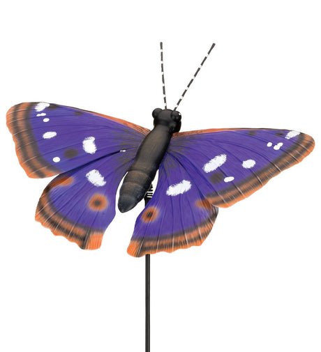 a close-up view of a metal, purple, emperor butterfly stake