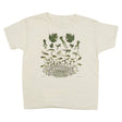 Beige t-shirt with illustrations of a frog's life cycle on a white background