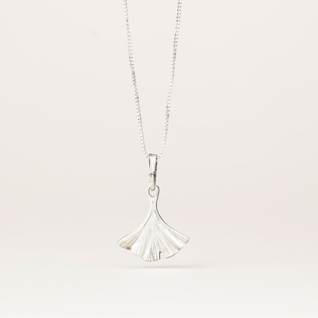 the back of the intricately detailed pewter ginkgo leaf shaped pendant hanging from a silver chain
