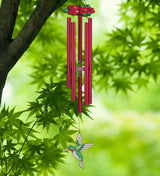Hummingbird Chimes with red floral canopy, redchime tubes, and stained glass style hummingbird sail seen hanging from a tree