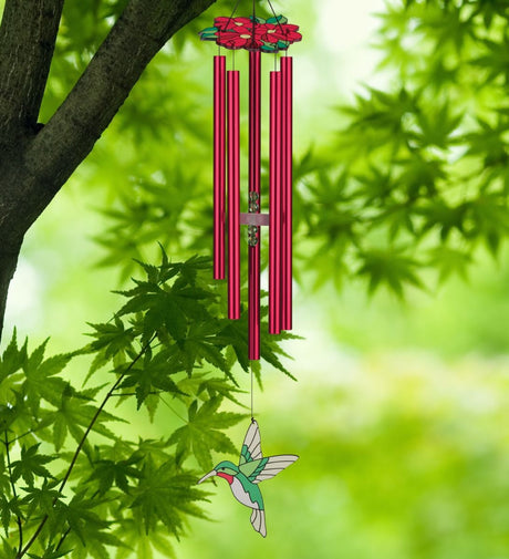 Hummingbird Chimes with red floral canopy, redchime tubes, and stained glass style hummingbird sail seen hanging from a tree