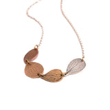 Necklace with hydrangea petal pendants on a white background