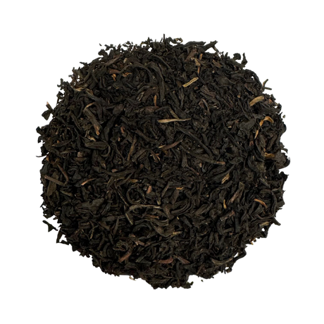 a round pile of lapsang souchong tea against a white background