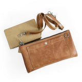 Brown leather clutch with a matching cardholder on a white background