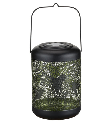 Close-up of the large hummingbird lantern, featuring laser-cut hummingbird designs with a reflective metallic glow