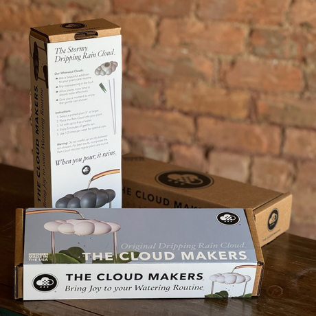 The Cloud Makers packaging with a brick wall background