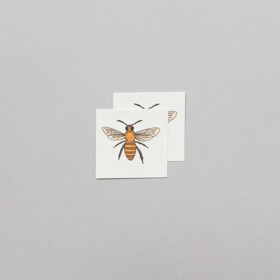 two sets of honey bee temporary tattoos showing the tattoo layout on the sheets