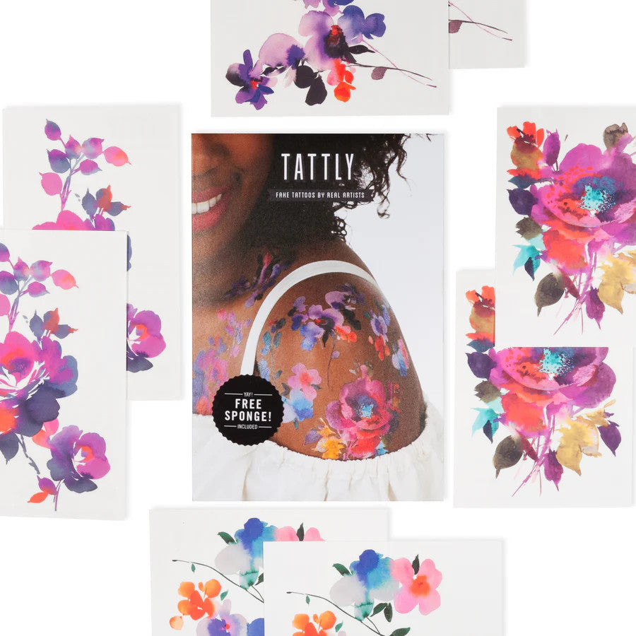 the whole set of 8 tattoos of the in bloom tattoo set - each is vividly colorful and painterly in style, surrounding the package for the set